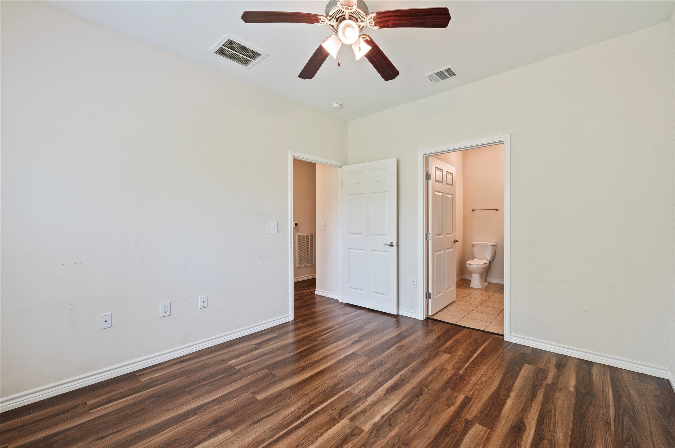 1125 Lake Road La Marque, TX 77568 - Photo 19 of 33 a view of an empty room and wooden floor