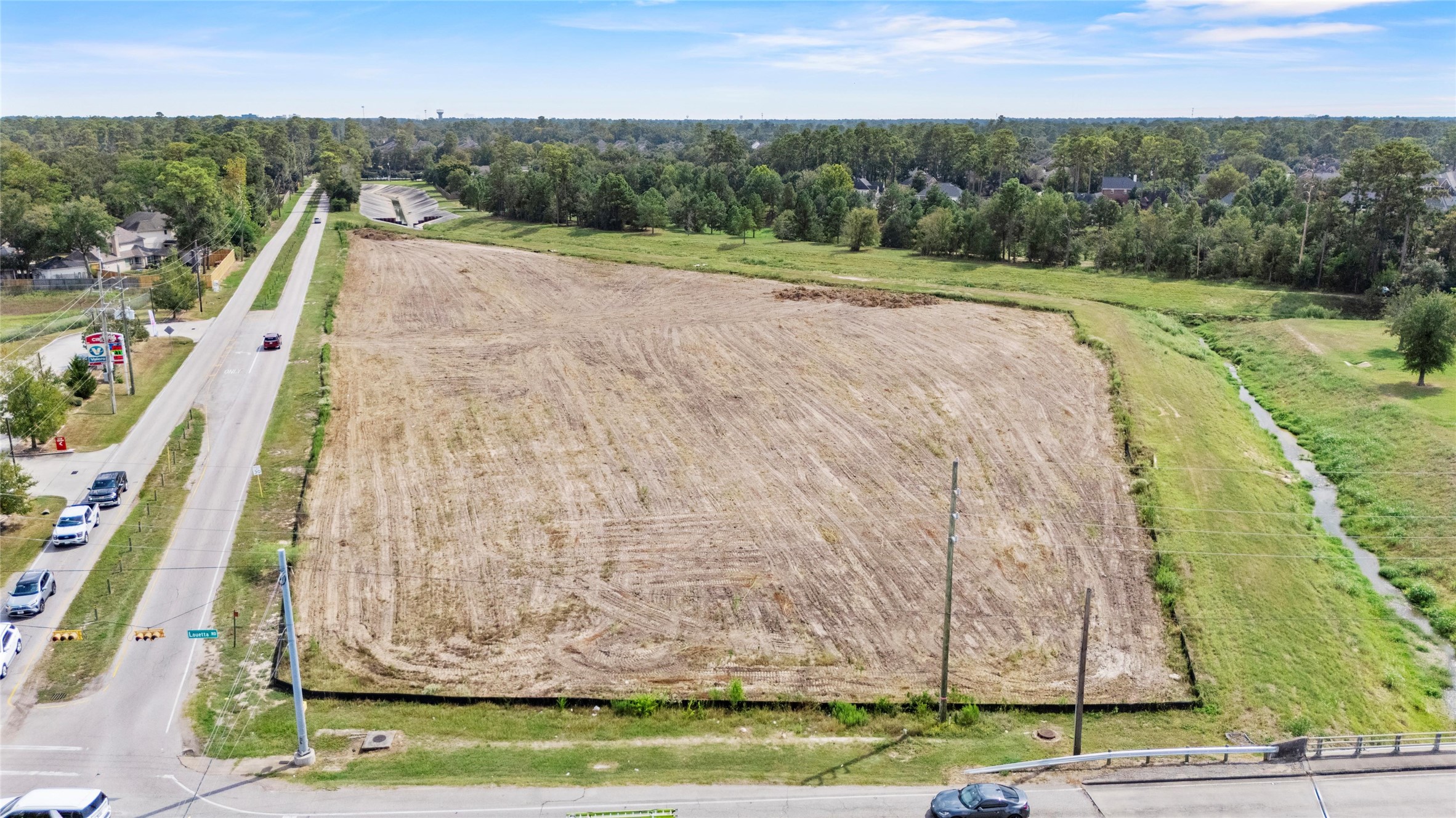0 Louetta Road Spring, TX 77388 - Photo 3 of 9 a view of a backyard with plants and large trees