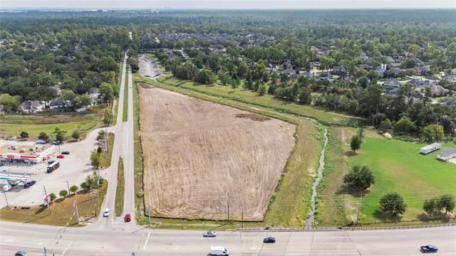 an aerial view of residential house and car parked