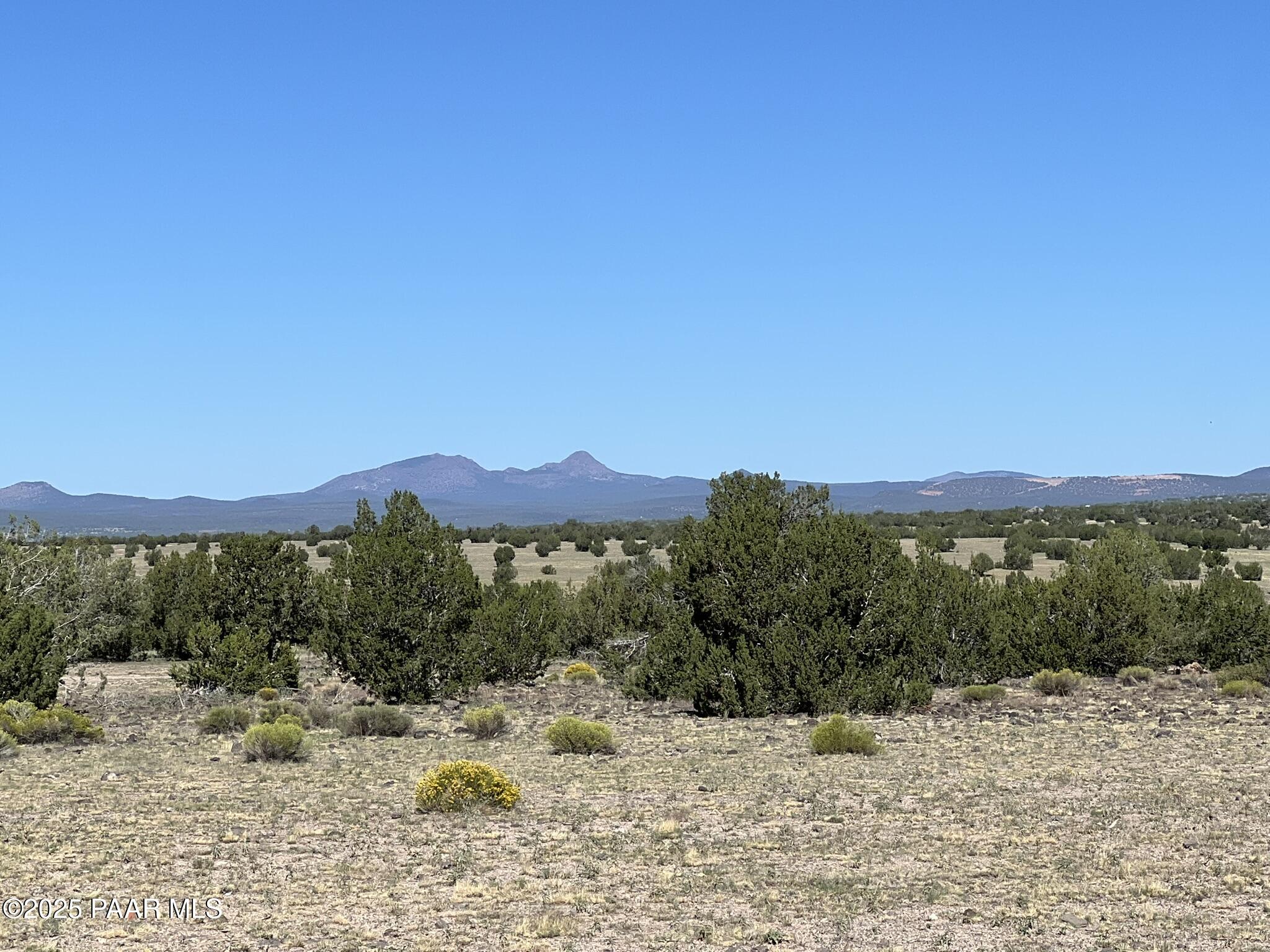 18 B West Warren Run Road Ash Fork, AZ 86320 - Photo 10 of 13 a view of a mountain with a outdoor space