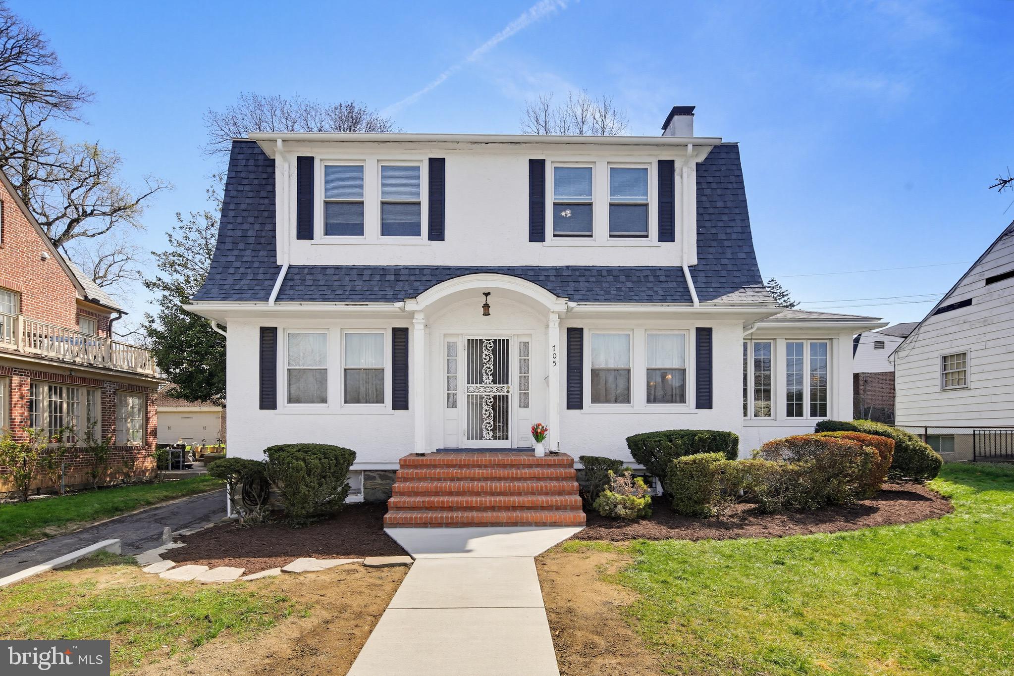 Dutch Colonial with sunroom and detached garage