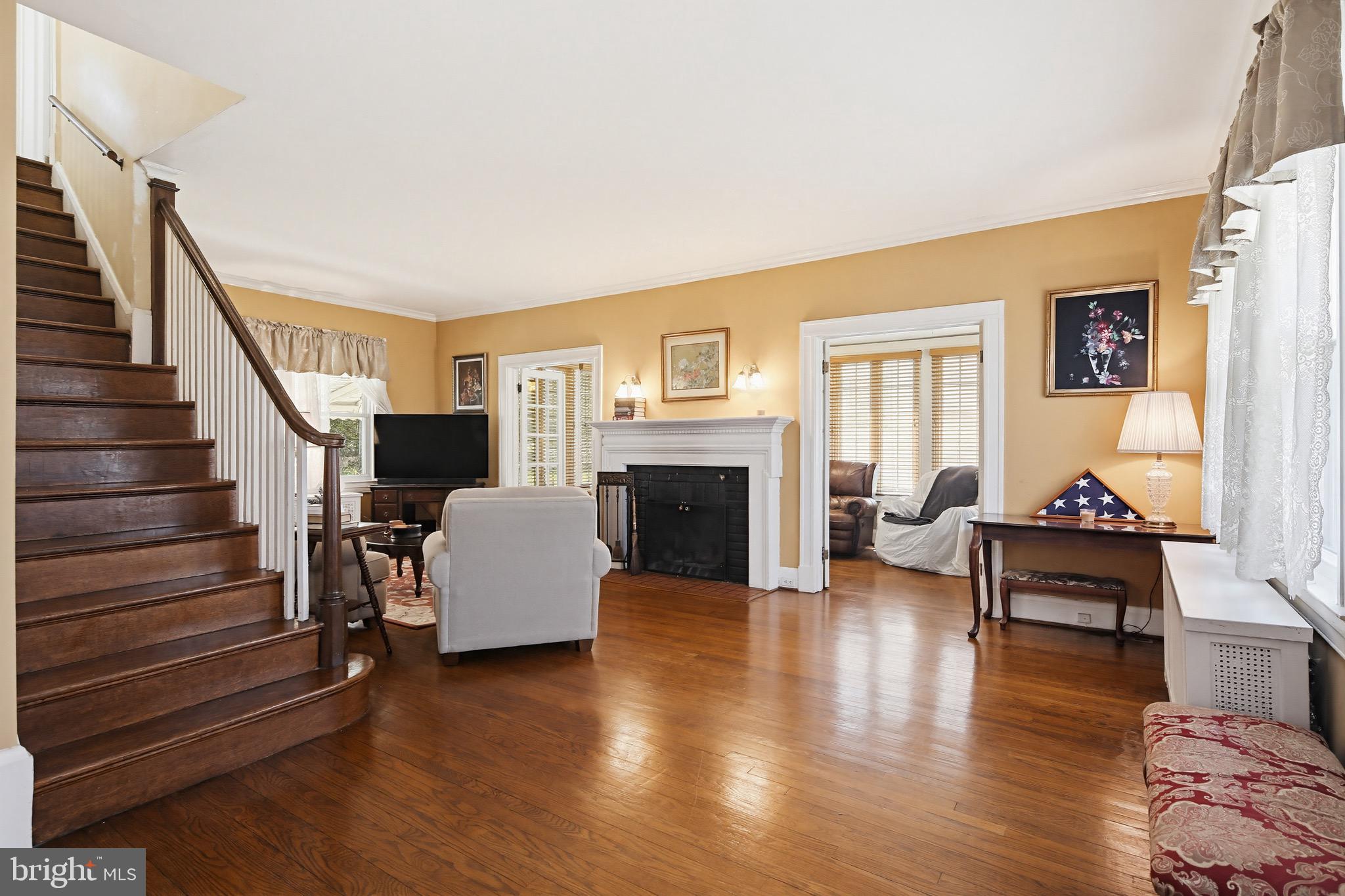 705 Winans Way Baltimore, MD 21229 - Photo 11 of 43 Lrg living rm leads to Sun rm w/ dual french doors