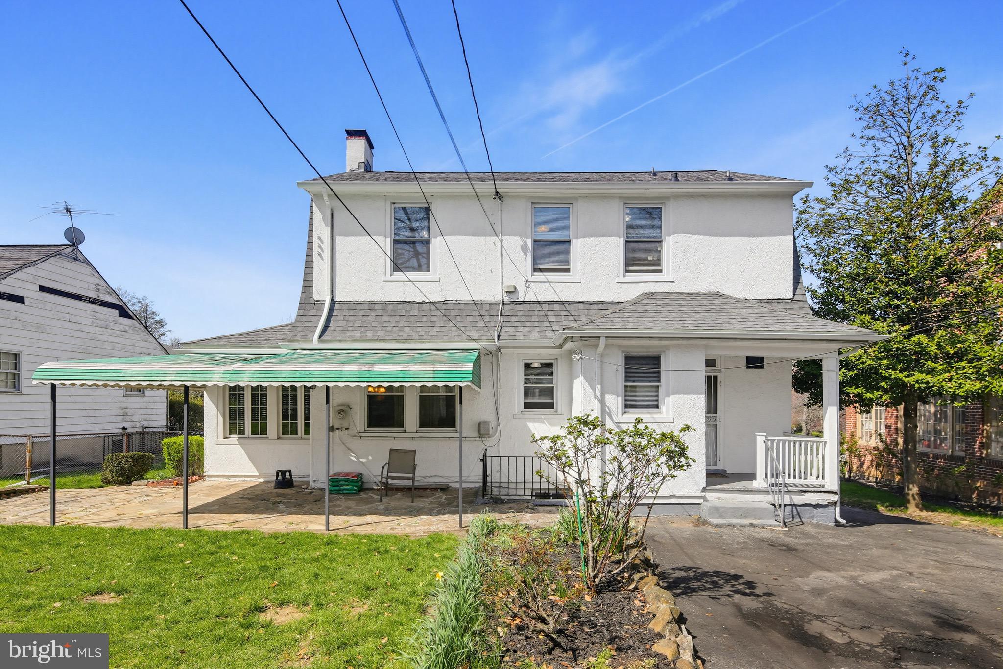 705 Winans Way Baltimore, MD 21229 - Photo 4 of 43 Level backyard with covered flagstone patio