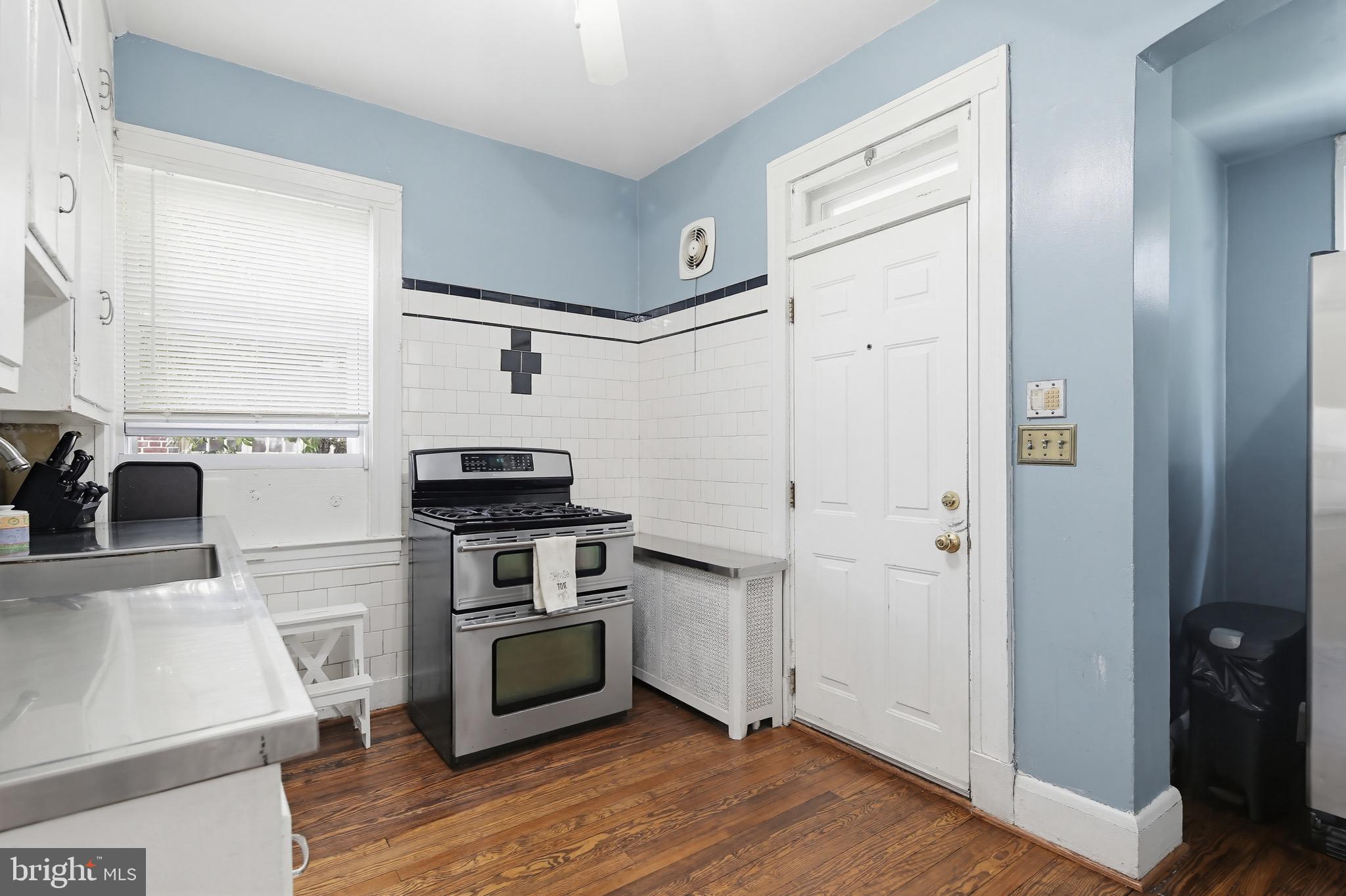705 Winans Way Baltimore, MD 21229 - Photo 8 of 43 Functional kitchen w/ hardwood floors