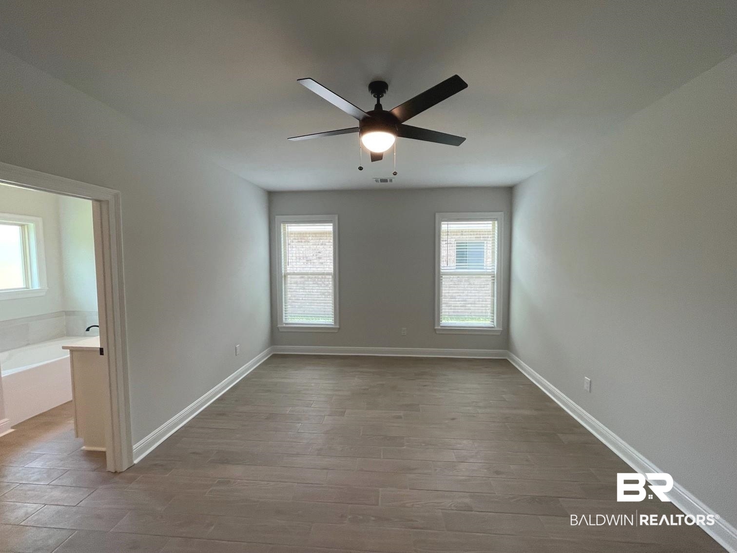 1626 Fenton Circle Foley, AL 36535 - Photo 6 of 16 Empty room with ceiling fan and hardwood / wood-style floors