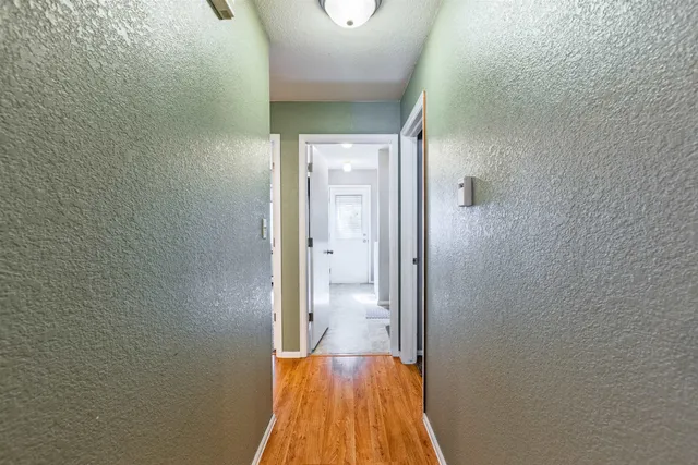 a view of a bathroom from a hallway