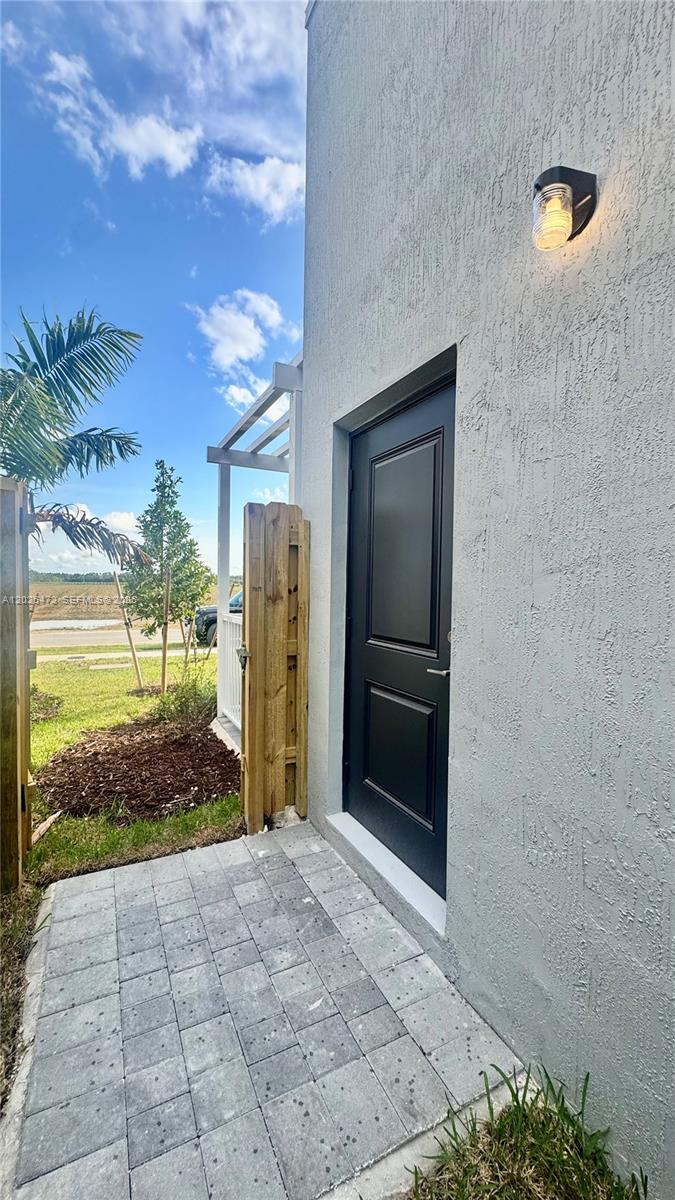 19479 Southwest 340th Street, Unit 1 Homestead, FL 33034 - Photo 5 of 58 a view of a outdoor space