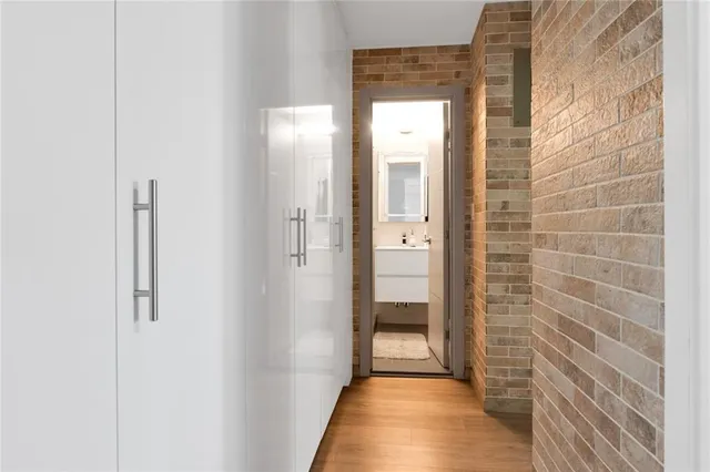 a view of a bathroom from a hallway