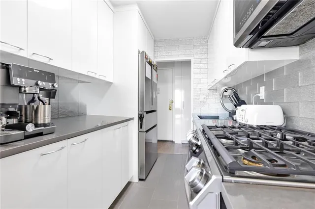 a kitchen with a stove and a refrigerator