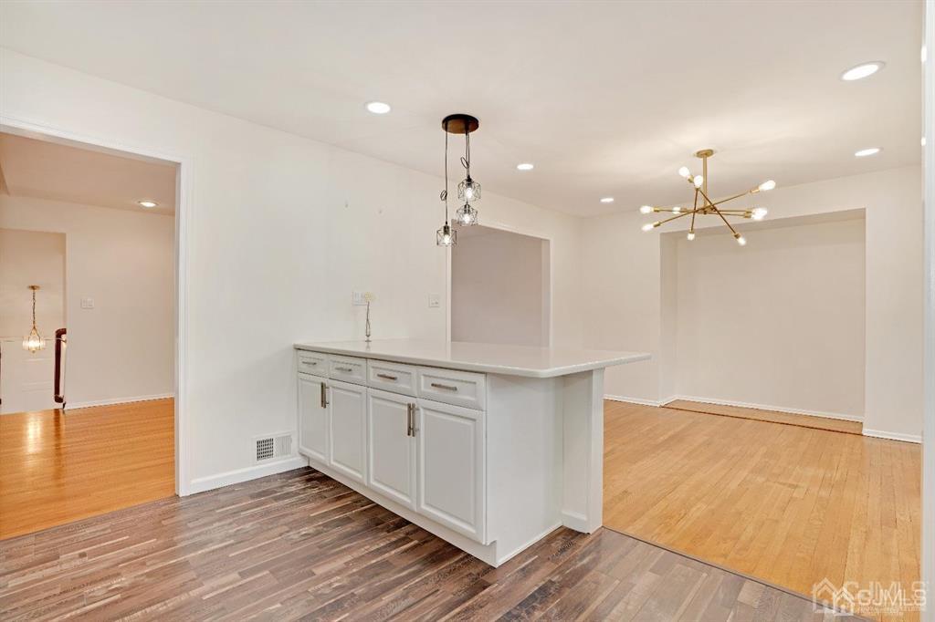 63 South Cliff Road Colonia, NJ 07067 - Photo 11 of 37 a view of a kitchen with a sink and wooden floor