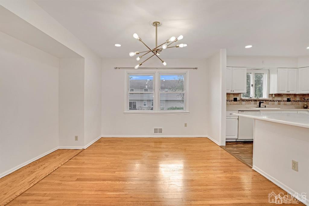 63 South Cliff Road Colonia, NJ 07067 - Photo 12 of 37 a view of a kitchen with microwave and cabinets