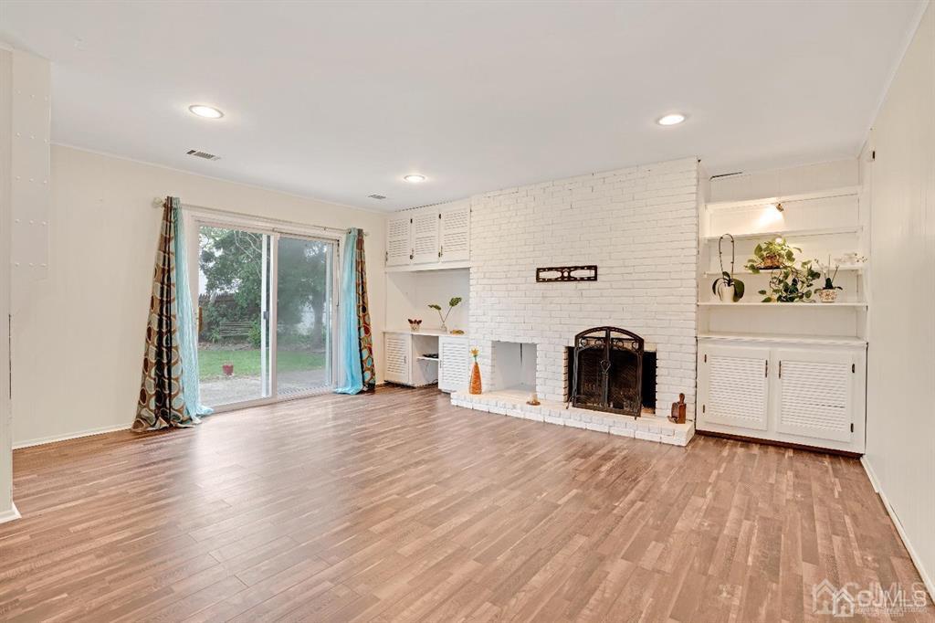 63 South Cliff Road Colonia, NJ 07067 - Photo 14 of 37 a view of a livingroom with a fireplace and window
