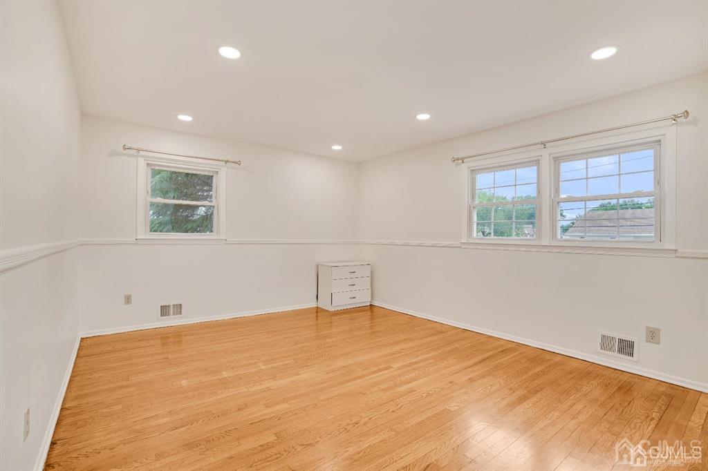 63 South Cliff Road Colonia, NJ 07067 - Photo 19 of 37 a room with a bed and a window