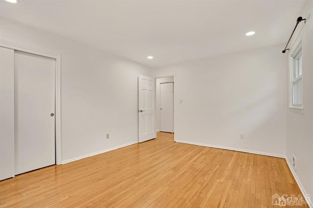 63 South Cliff Road Colonia, NJ 07067 - Photo 24 of 37 a view of empty room with wooden floor