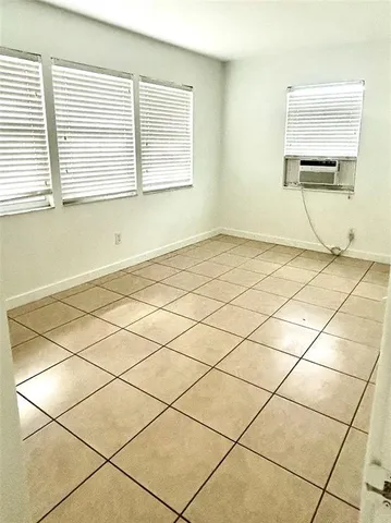 a bathroom with a granite countertop sink a toilet and bathtub