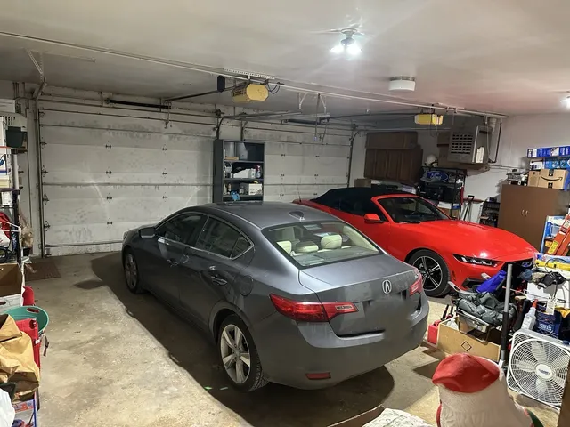 a car and bike parked in a garage