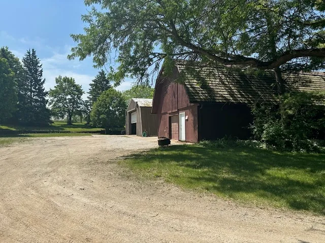 a backyard of a house with lots of green space