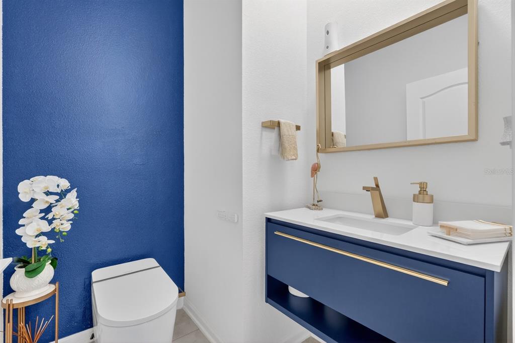 336 Redbud Road Palm Coast, FL 32137 - Photo 11 of 40 a bathroom with a sink vanity and a toilet