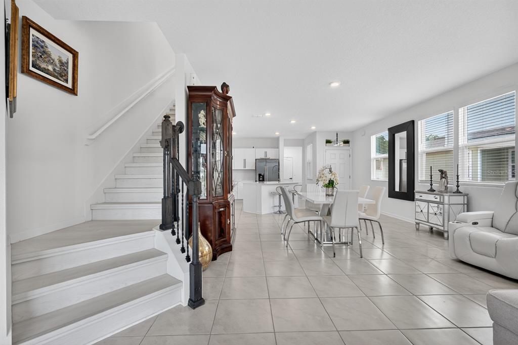 336 Redbud Road Palm Coast, FL 32137 - Photo 12 of 40 a room with lots of white furniture and entryway