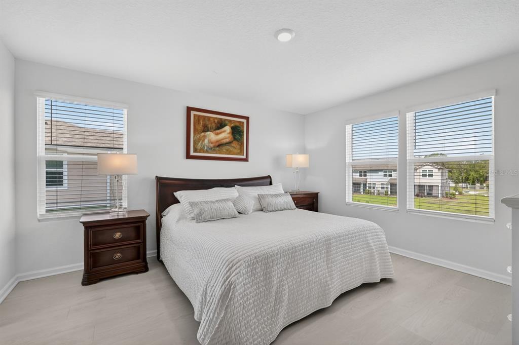 336 Redbud Road Palm Coast, FL 32137 - Photo 13 of 40 a bedroom with a bed next to a window
