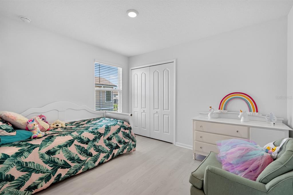 336 Redbud Road Palm Coast, FL 32137 - Photo 18 of 40 a bedroom with a bed and a window