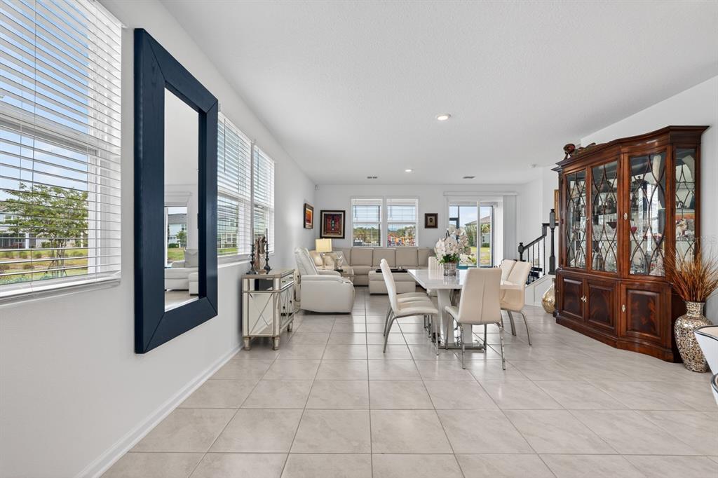 336 Redbud Road Palm Coast, FL 32137 - Photo 22 of 40 a living room with furniture and large windows