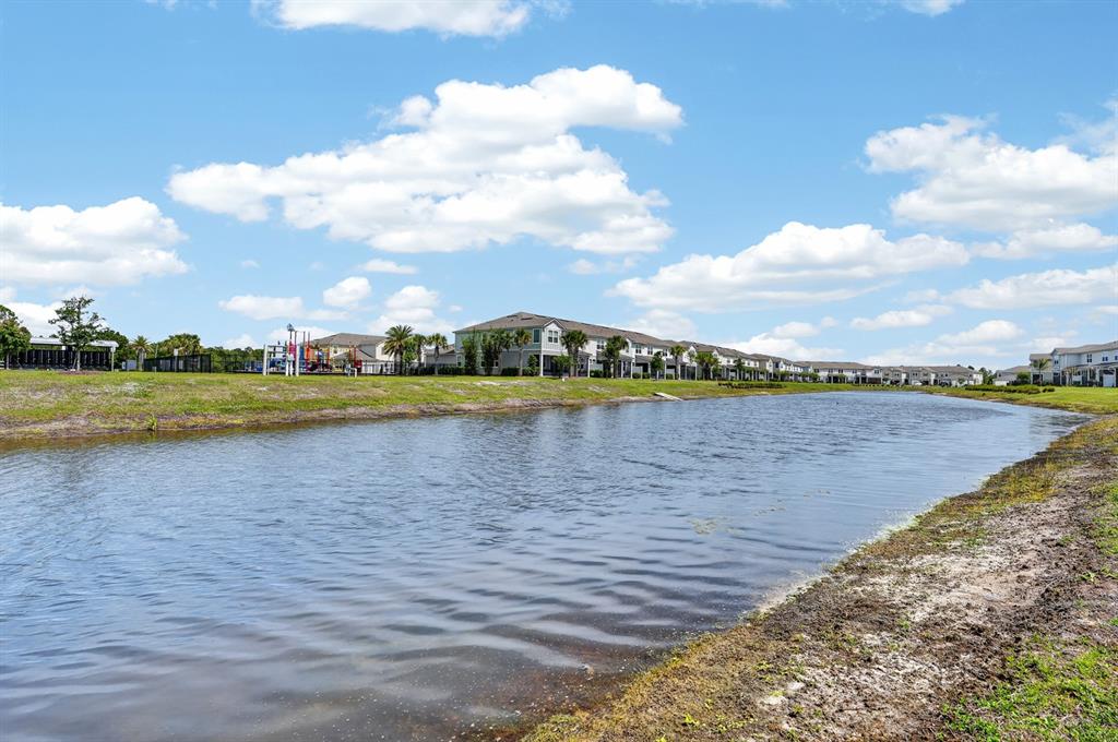336 Redbud Road Palm Coast, FL 32137 - Photo 29 of 40 a view of a lake with houses in the back