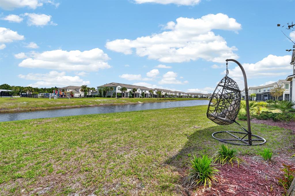 336 Redbud Road Palm Coast, FL 32137 - Photo 31 of 40 a view of a lake with a city
