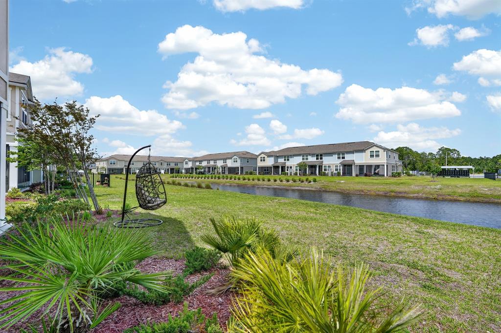 336 Redbud Road Palm Coast, FL 32137 - Photo 32 of 40 a view of a lake with houses