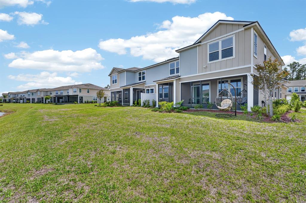 336 Redbud Road Palm Coast, FL 32137 - Photo 33 of 40 a house view with swimming pool and garden space