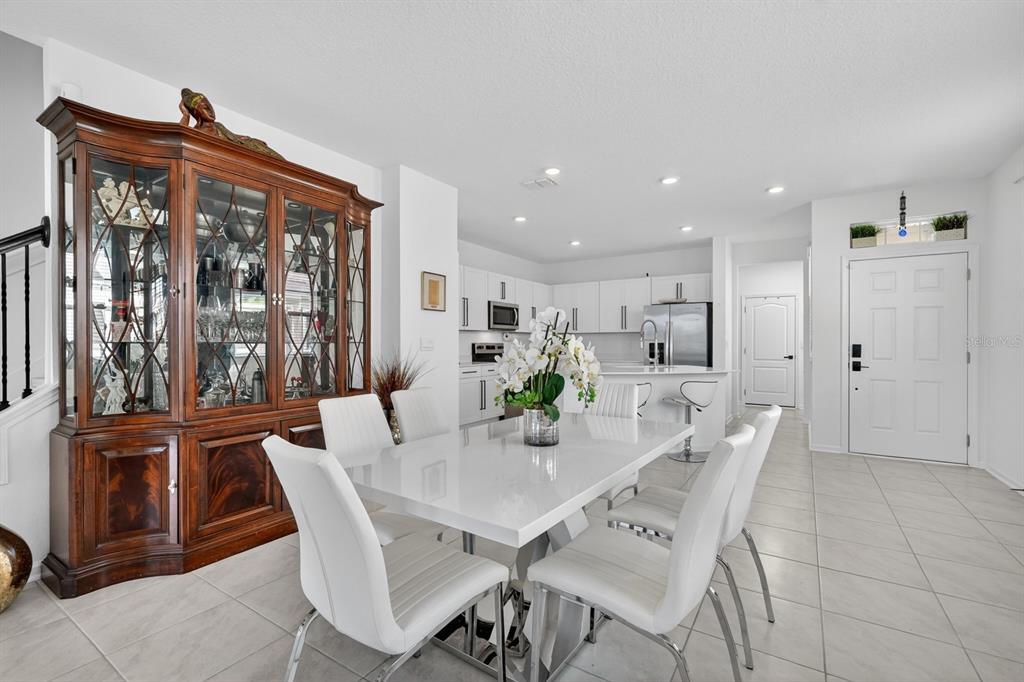 336 Redbud Road Palm Coast, FL 32137 - Photo 6 of 40 a view of a dining room with furniture window and outside view