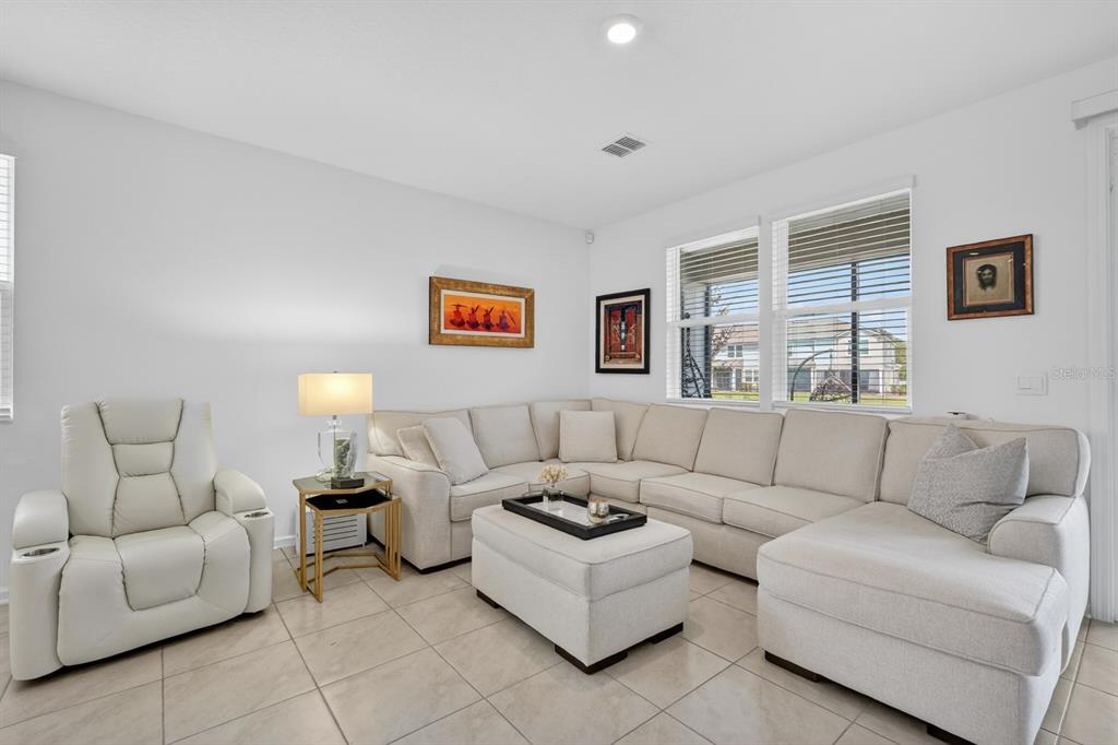 336 Redbud Road Palm Coast, FL 32137 - Photo 8 of 40 a living room with furniture and a couch