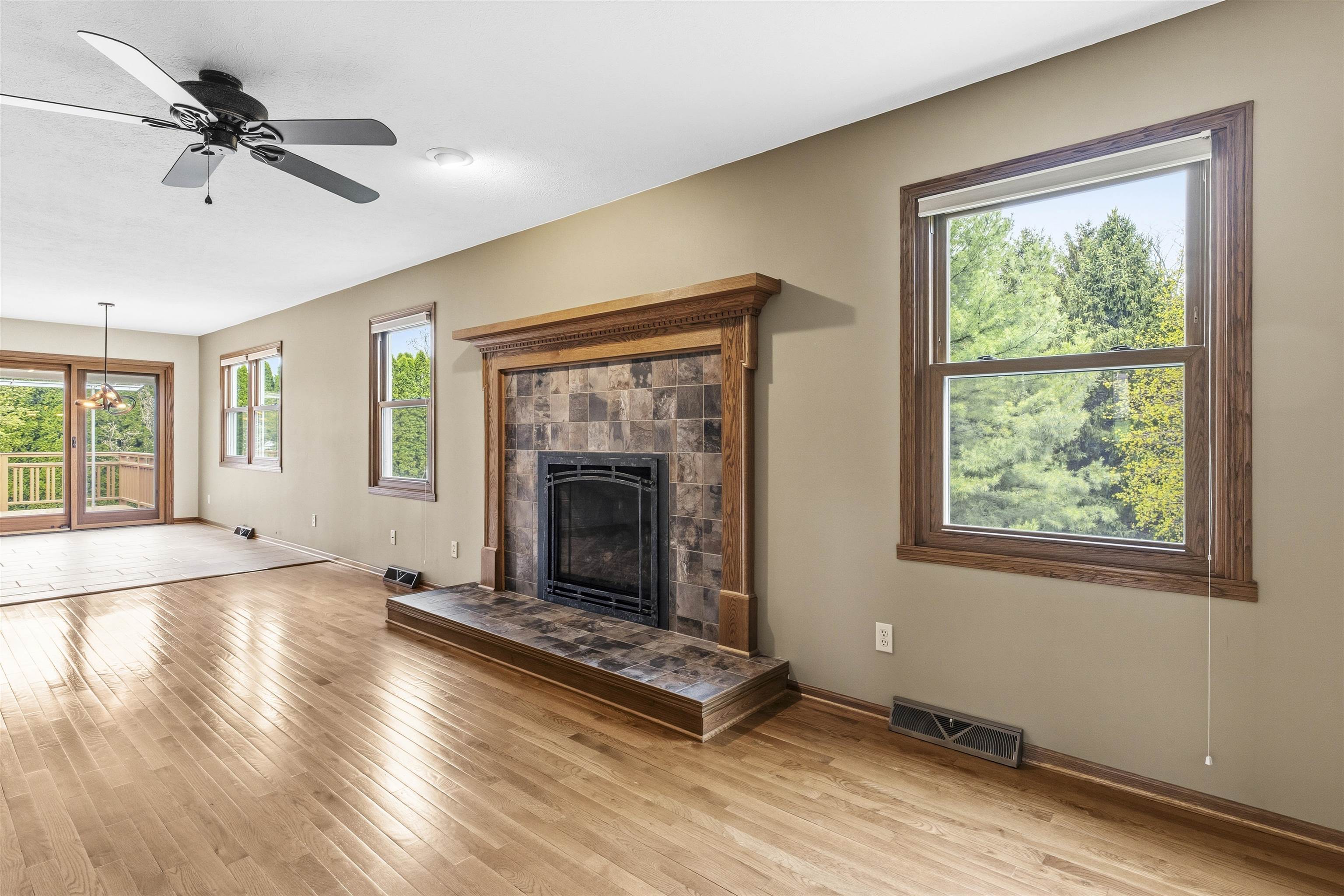 6990 Skyview Trail Roscoe, IL 61073 - Photo 12 of 43 a living room with fireplace furniture and a window