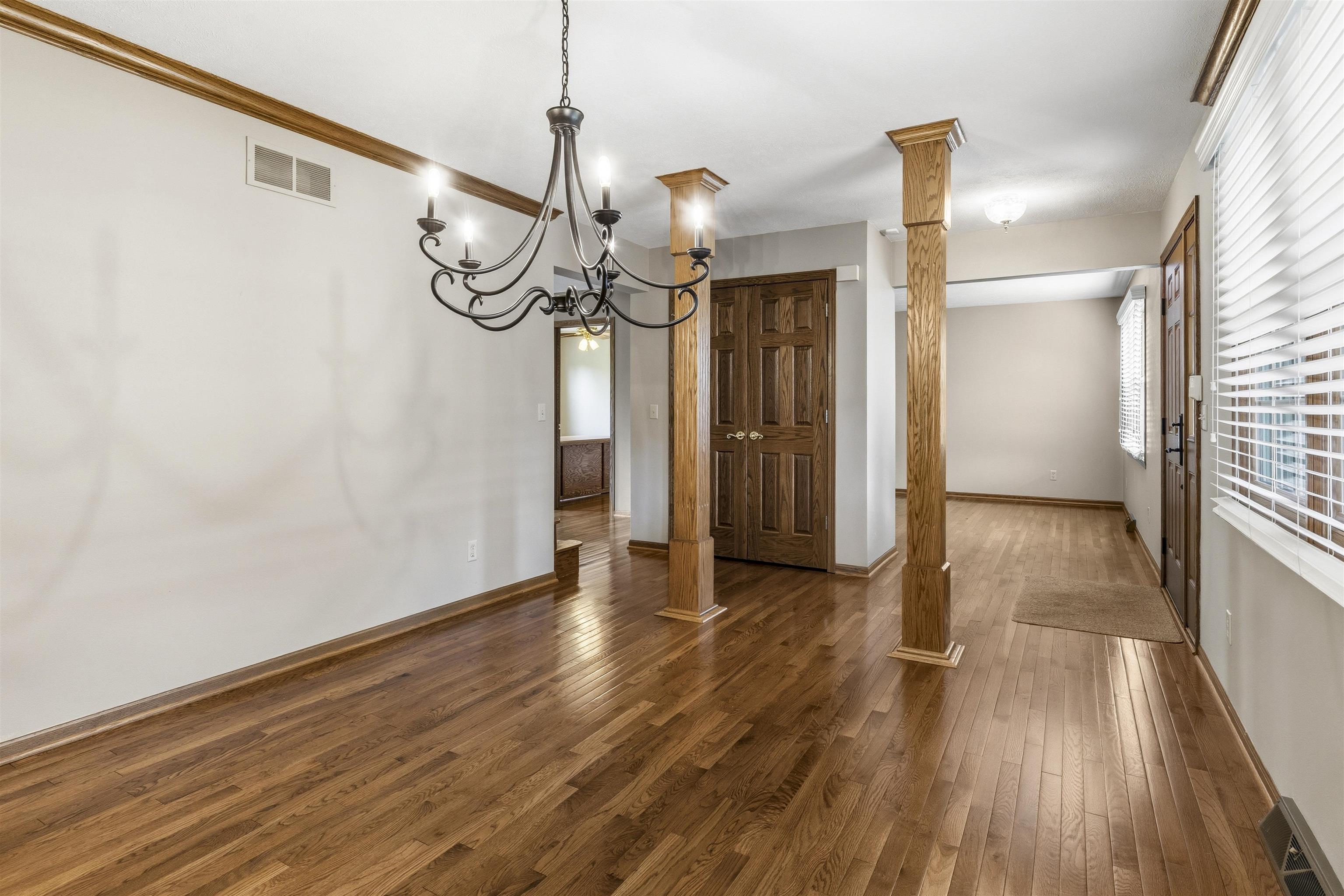6990 Skyview Trail Roscoe, IL 61073 - Photo 13 of 43 a view of a hallway with wooden floor