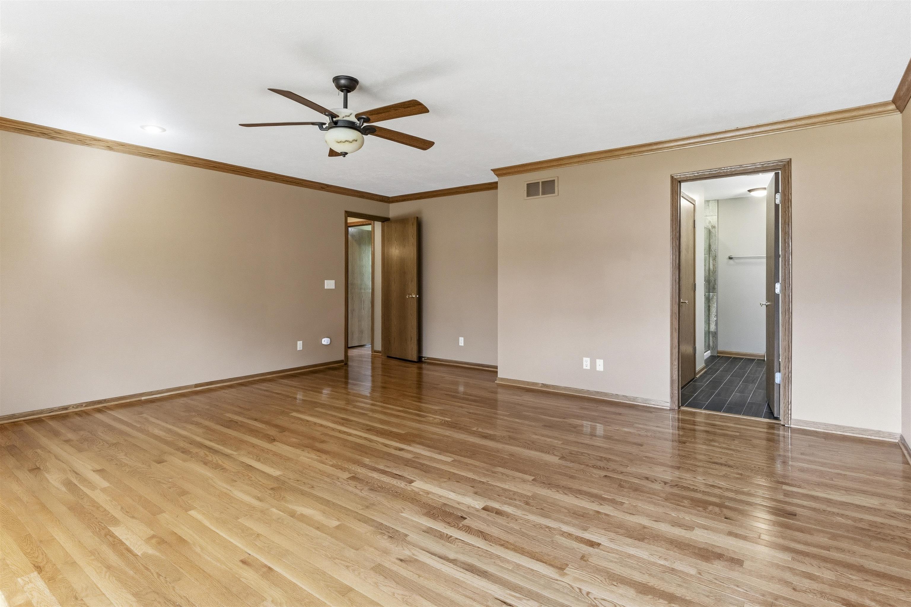 6990 Skyview Trail Roscoe, IL 61073 - Photo 19 of 43 a view of empty room with wooden floor