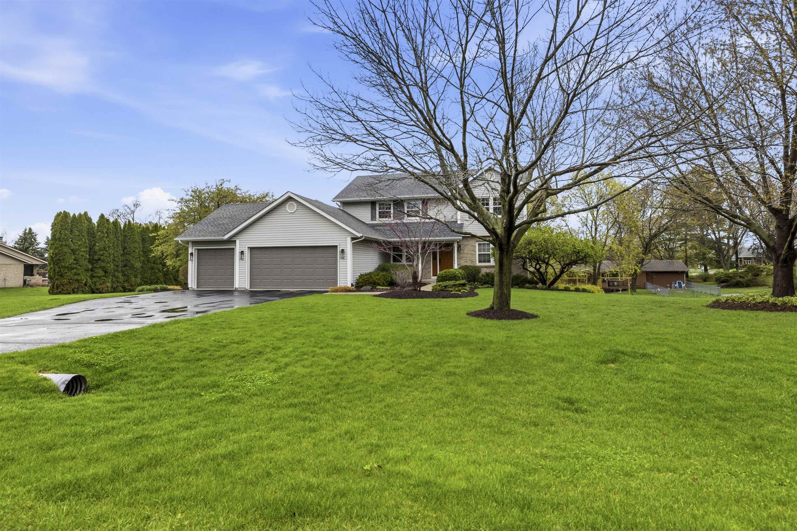 6990 Skyview Trail Roscoe, IL 61073 - Photo 3 of 43 a view of a house with a big yard