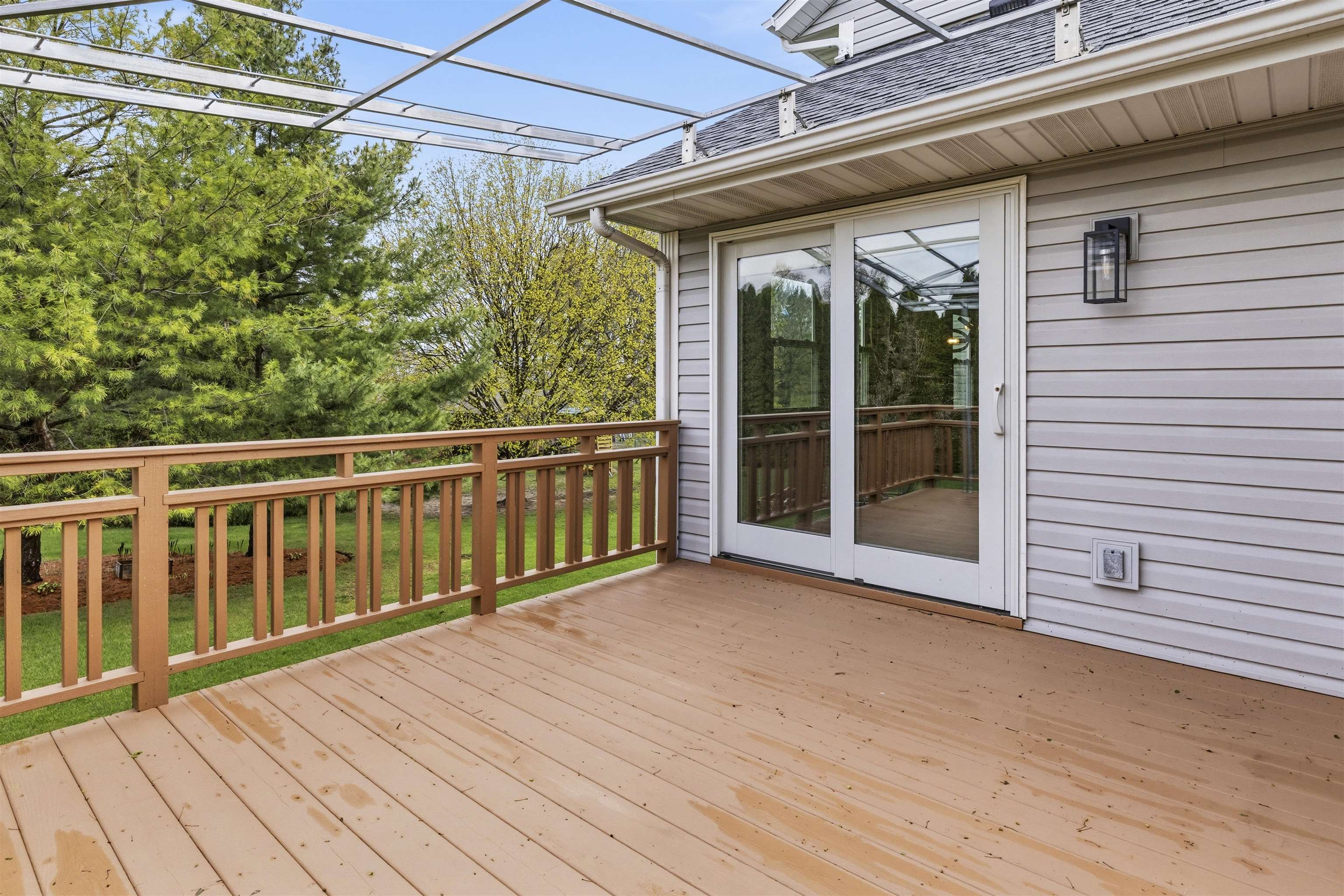 6990 Skyview Trail Roscoe, IL 61073 - Photo 32 of 43 a view of backyard with large trees and wooden floor