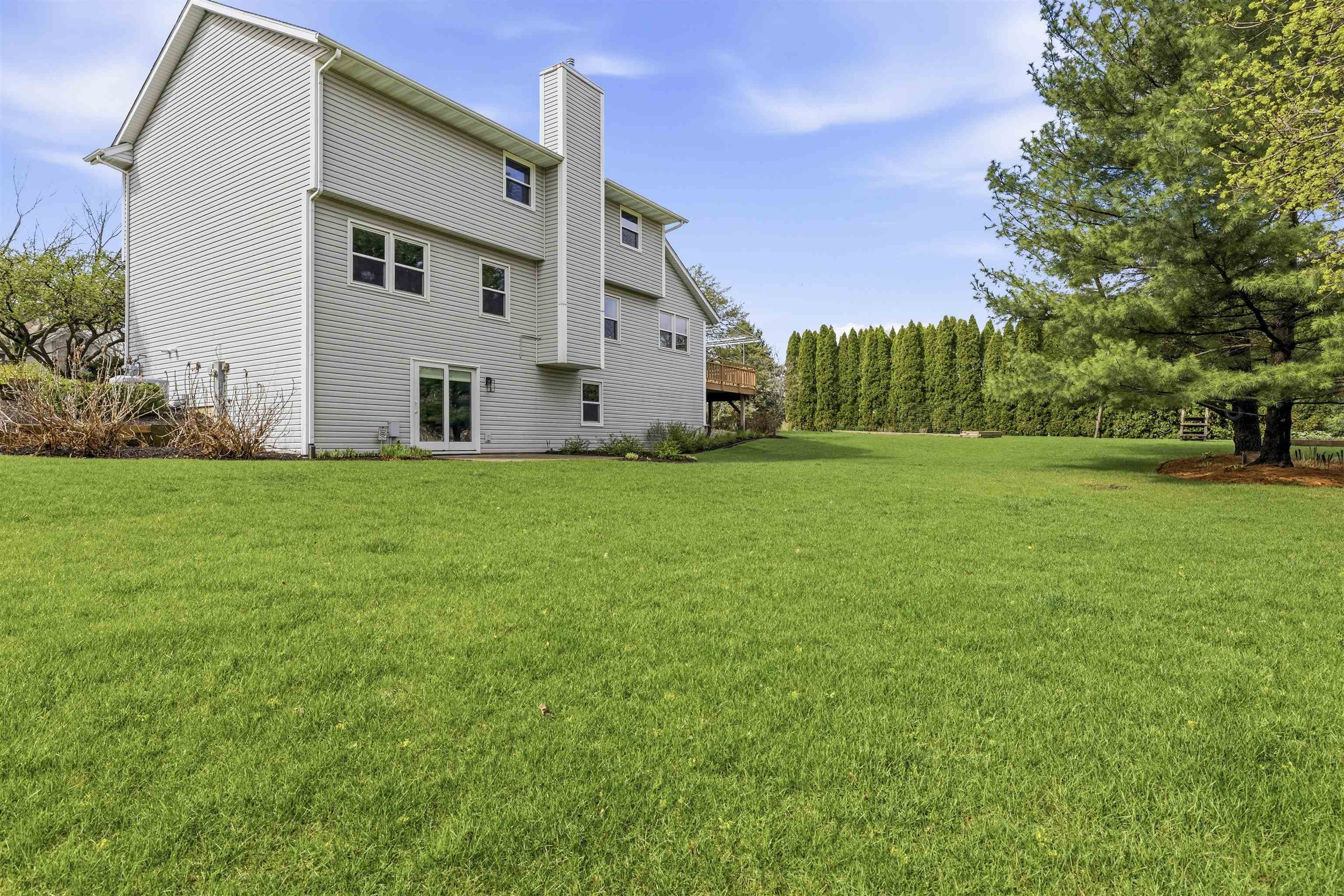 6990 Skyview Trail Roscoe, IL 61073 - Photo 40 of 43 a view of a house with a big yard