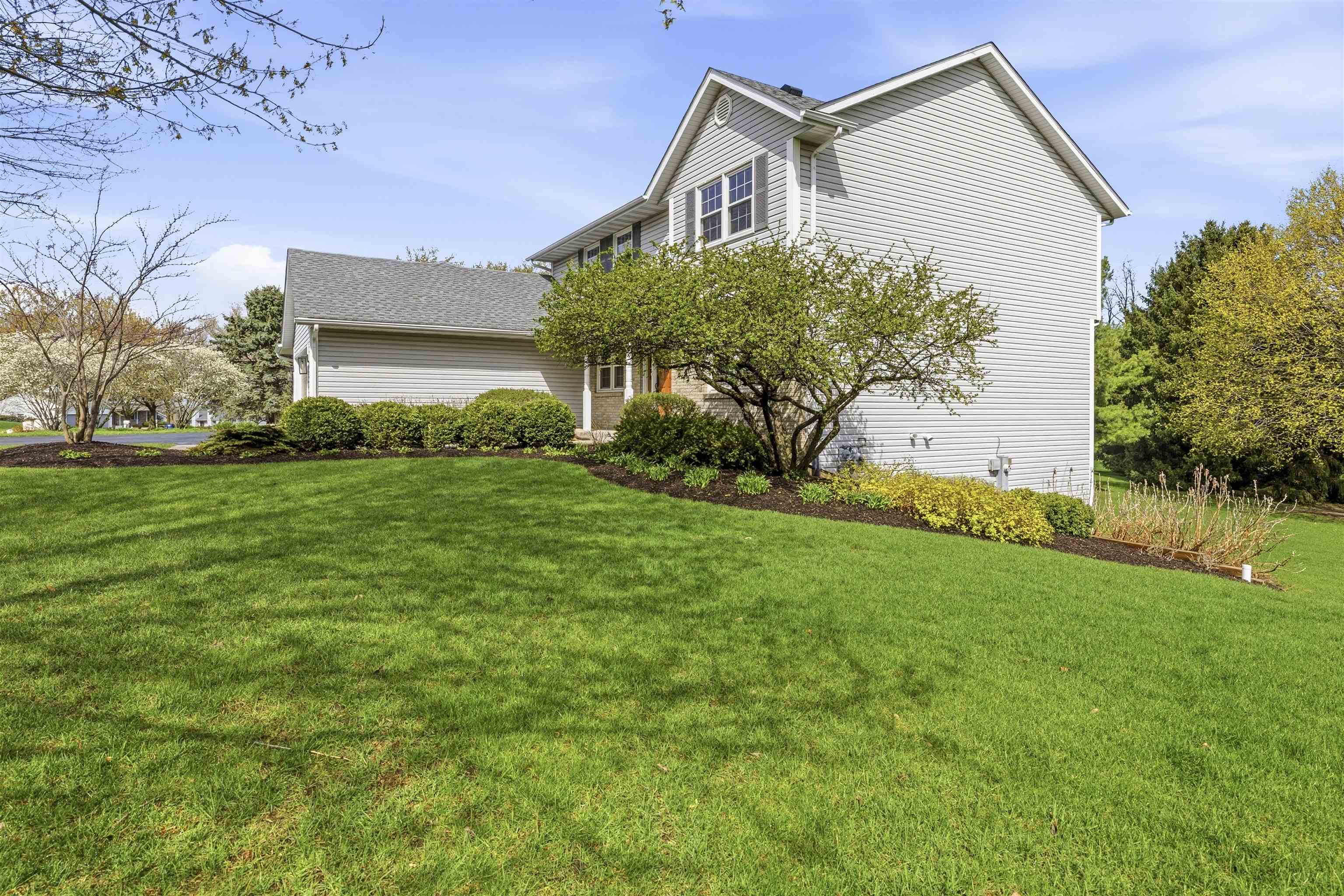 6990 Skyview Trail Roscoe, IL 61073 - Photo 41 of 43 a front view of house with yard and green space