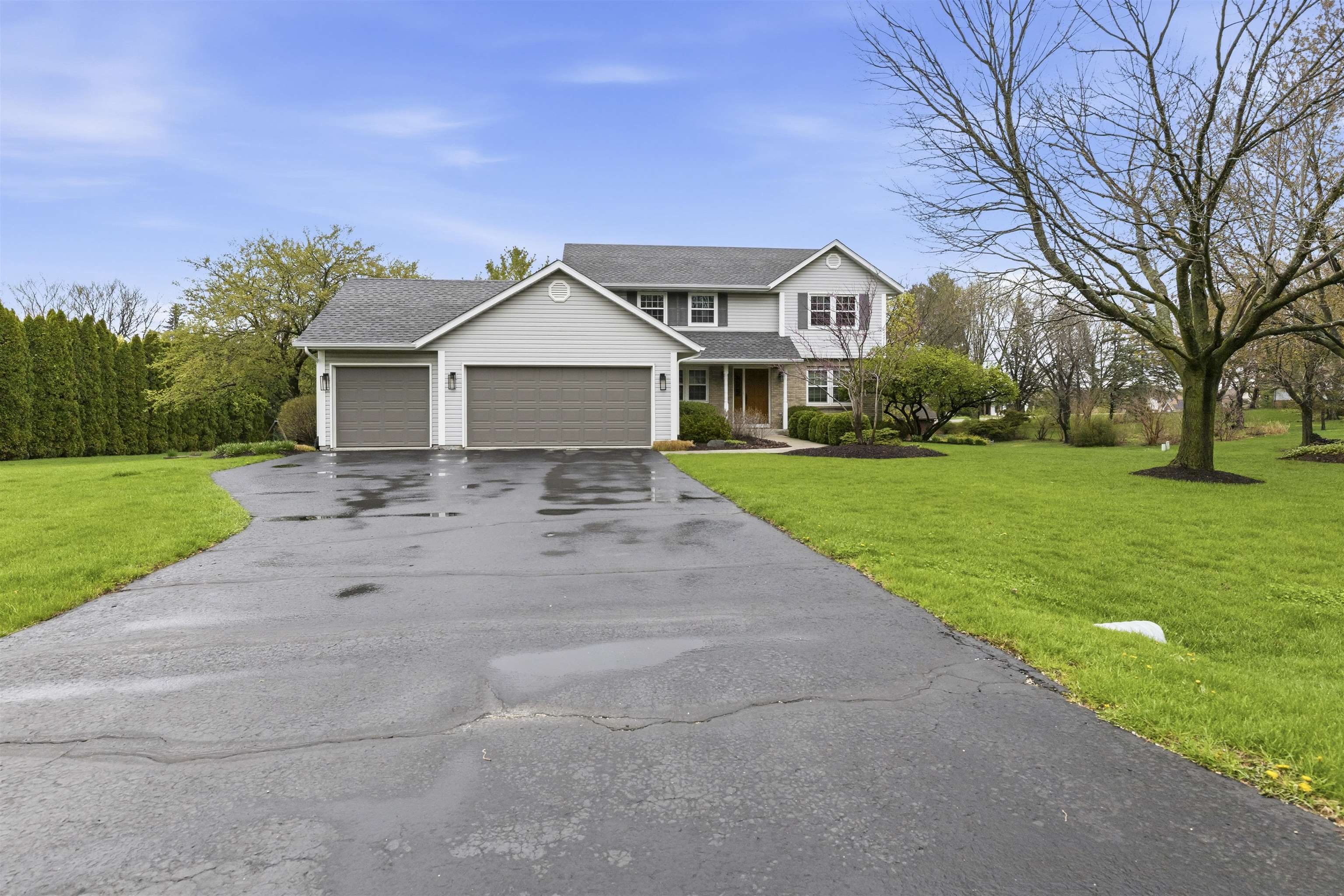 6990 Skyview Trail Roscoe, IL 61073 - Photo 43 of 43 a front view of a house with yard
