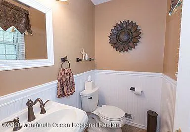 a bathroom with a toilet and a sink