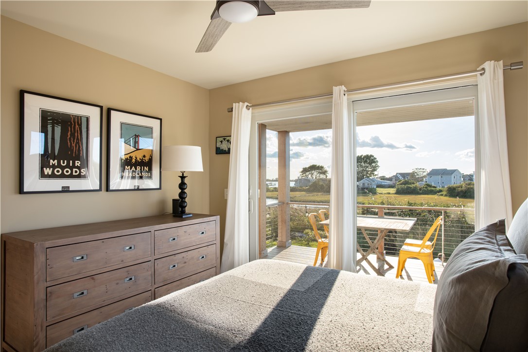 56 Conch Road Narragansett, RI 02882 - Photo 14 of 21 Primary Bedroom w/Water View; Slider opens to Lower Deck