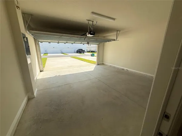 a kitchen with a white stove top oven and sink