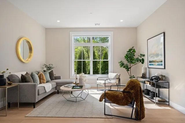 a bed room with a bed and a chair