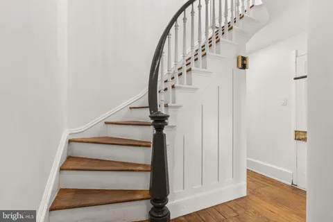 a view of a pathway both side of house