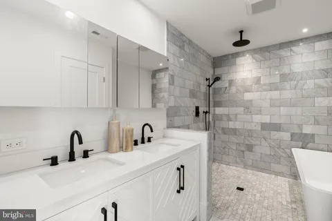 a view of a hallway with a white walls and stairs