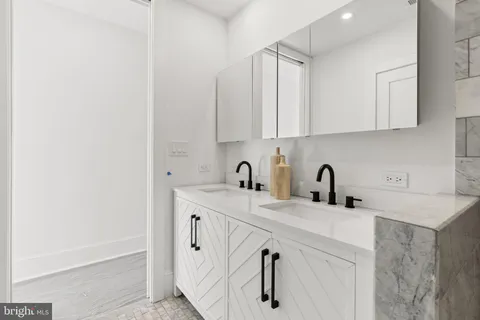 a view of staircase with railing and a window