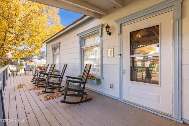 a view of a outdoor seating area with furniture and wooden floor