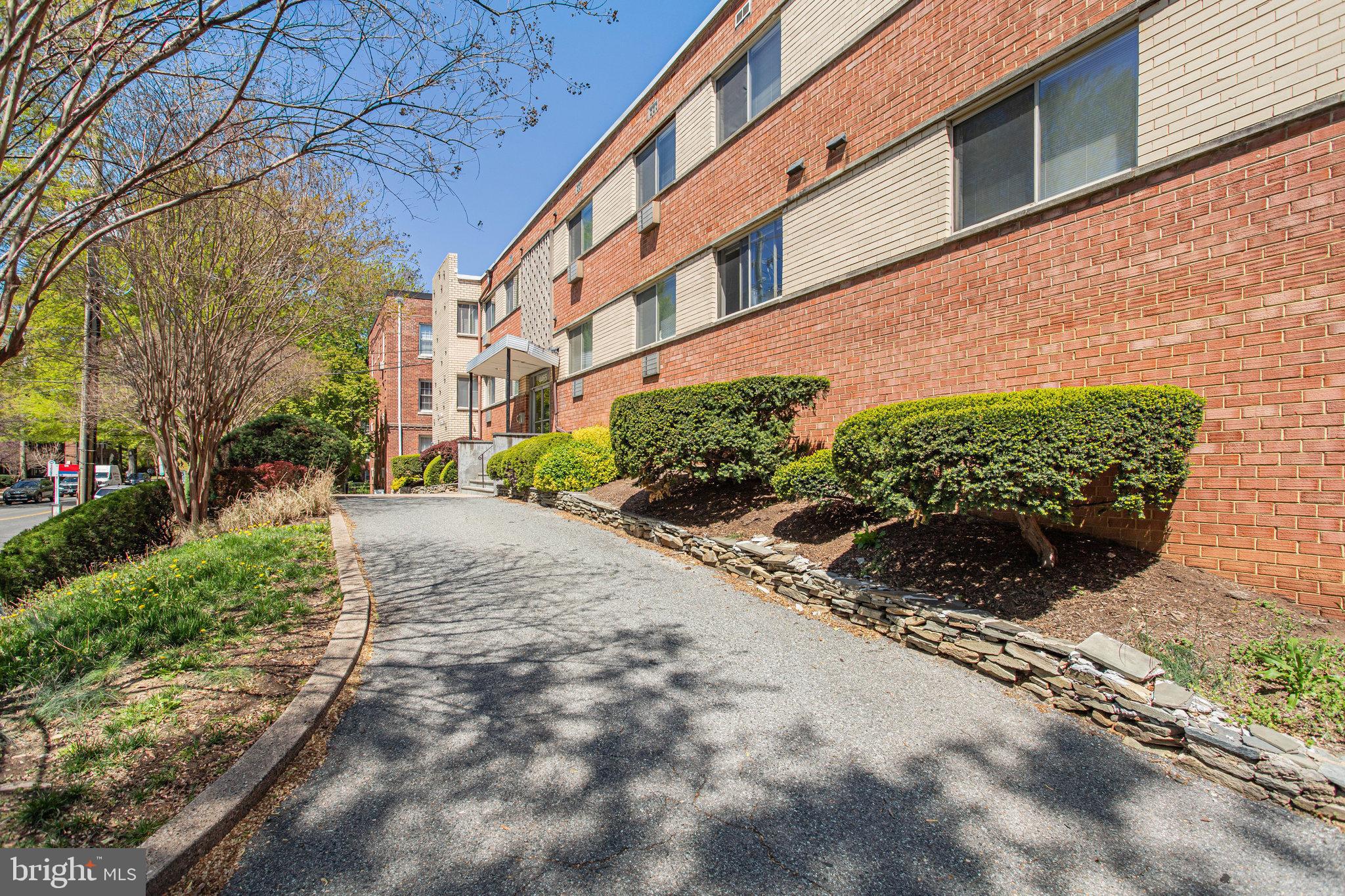 4465 MacArthur Boulevard Northwest, Unit 8 Washington, DC 20007 - Photo 3 of 6 a pathway of a house with a yard