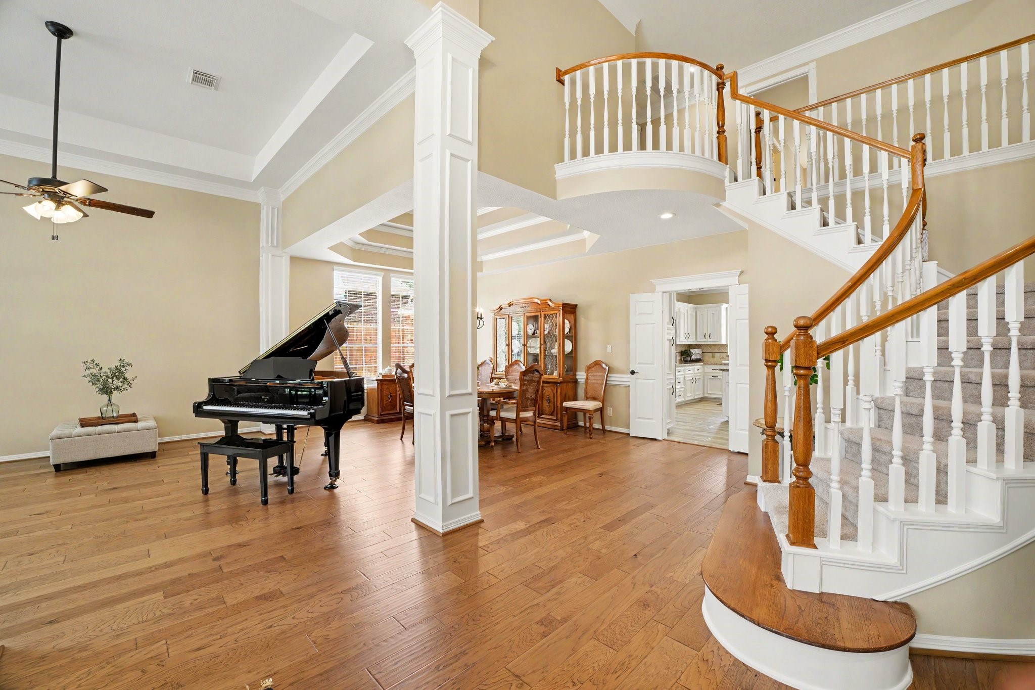 3411 Fir Forest Drive Spring, TX 77388 - Photo 4 of 39 Grand entryway with soaring ceilings, beautiful engineered wood flooring, and a grand split staircase that connects the living area/entry to the family room.